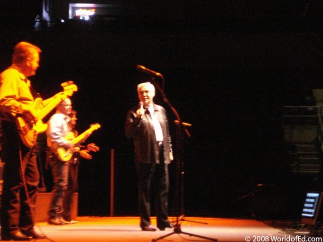 George Jones on stage performing.